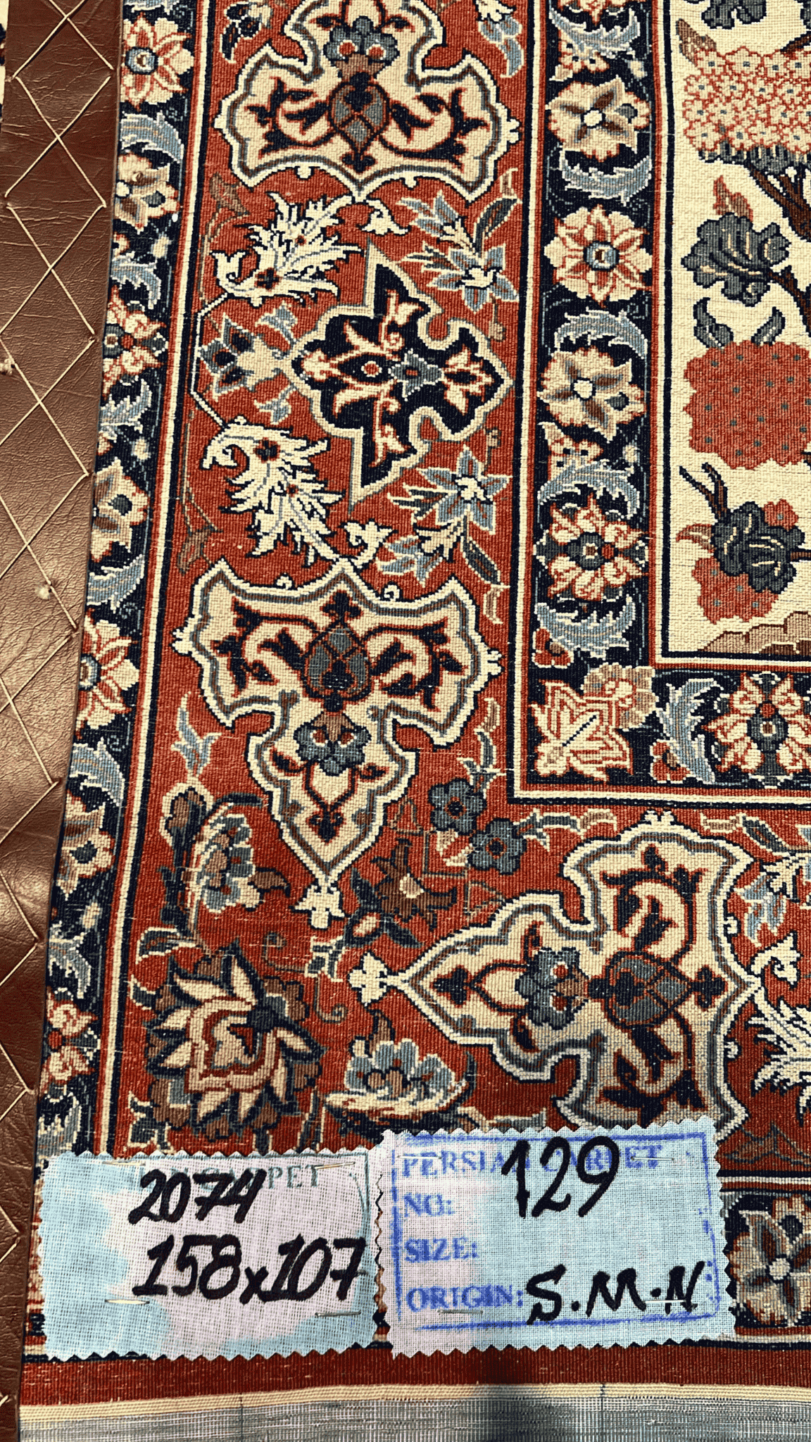 "Backside of a Seirafian rug by Master Bagher Seirafian, displaying fine knot craftsmanship and silk warp structure, made in Isfahan."